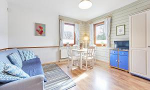 a living room with a couch and a table at Willa Widok in Szczyrk +27 photos
