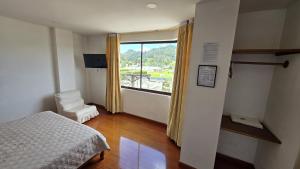 Un pat sau paturi într-o cameră la Hotel Imperial