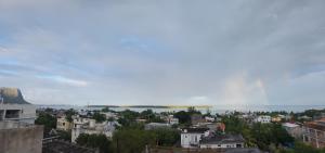 a view of a city with the water in the background at Le Chaleureux in La Gaulette