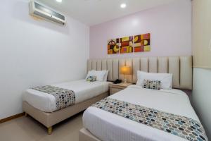 Postel nebo postele na pokoji v ubytování Hotel Costa Bonita