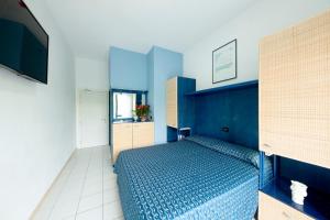 Postel nebo postele na pokoji v ubytování Hotel Olanda