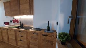 a kitchen with a sink and a counter top at CAV MES VALLEES La Thuile in La Thuile