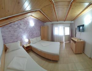 En eller flere senge i et værelse på Casa de vacanță Ana și Ștefan