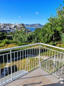 a boardwalk with a view of the water at LA CAVA DI DAFNE in Bacoli