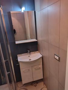 a bathroom with a sink and a mirror at LA CAVA DI DAFNE in Bacoli +25 photos