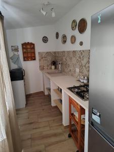 Kuchyň nebo kuchyňský kout v ubytování Casa Emma