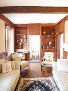a living room with two couches and a rug at walnutwood in Owings Mills