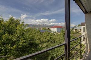 a balcony with a view of a city at Частный сектор in Bosteri