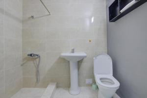 a bathroom with a toilet and a sink at Частный сектор in Bosteri
