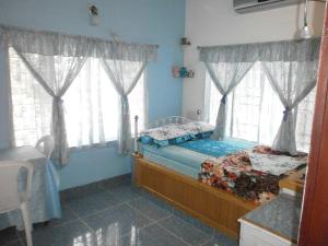 Postel nebo postele na pokoji v ubytování Aldos Ark Home Stay