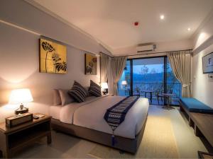 Postel nebo postele na pokoji v ubytování Fortune Riverview Hotel Chiang Khong