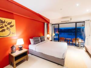 Postel nebo postele na pokoji v ubytování Fortune Riverview Hotel Chiang Khong