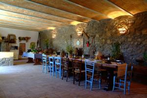 a large dining room with a long table and chairs at Valle del Tione-prenotazioni singole- in Canonica