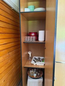 a pantry with a plate of food on a shelf at Dream House Šeha in Bihać