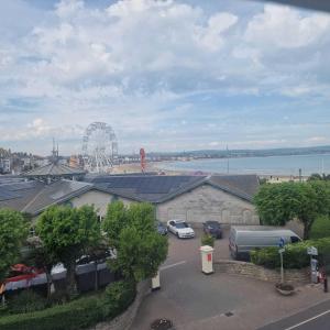 a view of a ferris wheel and a parking lot at Bayliss Hall in Weymouth +22 photos