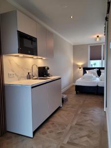 Ένα ή περισσότερα κρεβάτια σε δωμάτιο στο Luxe kamer Langendam 48 met privé terras