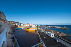 a view of the beach from the balcony of a building at ABLANCAS - La Restinga in La Restinga
