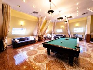 a living room with a pool table in it at Central Skylight Suites - The Breakroom in Bucharest
