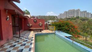 a swimming pool on the side of a building at Z villa in Mumbai