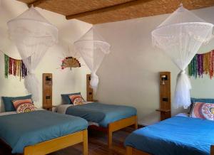 Ένα ή περισσότερα κρεβάτια σε δωμάτιο στο Eco Terra Lodge