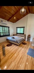 Postel nebo postele na pokoji v ubytování Noi’s Paradise Homestay