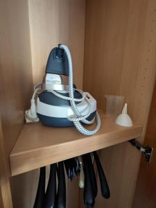 a telephone sitting on a shelf in a cabinet at Orchidea Borghese in Nettuno