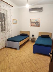 Postel nebo postele na pokoji v ubytování Villa ILIRIAN