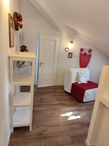 a small attic room with a bed and a ladder at Le Grenier Apartment in Turin +25 photos