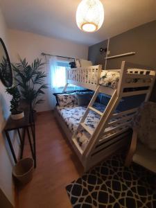 a bedroom with a bunk bed in a room at No1 Harbour view apartment Killybegs in Killybegs