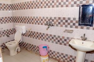 a bathroom with a toilet and a sink at Hotel Q victoria palace #tajmahal corridor & hotel lane in Agra
