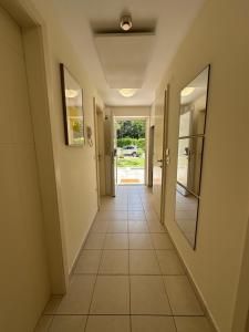a hallway of a house with a tile floor at Marina Residence Apartment 603 in Portorož