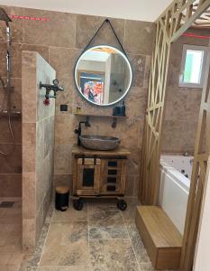 a bathroom with a sink and a mirror at Gîte Sainte Baume in Plan dʼAups +22 photos