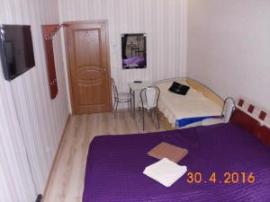 Säng eller sängar i ett rum på Kharkov CITIZEN