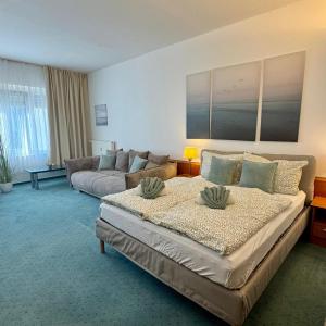 a living room with two beds and a couch at Smart In Kassel - Boardinghouse in Kassel