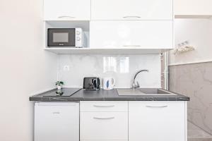 Kuchyň nebo kuchyňský kout v ubytování Super Central - NEW - Comfy Studio + 15 fotografií