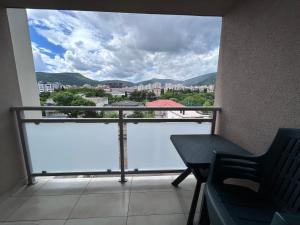 a balcony with a view of a city at Cozy corner Mostar in Mostar