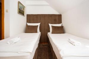 Ένα ή περισσότερα κρεβάτια σε δωμάτιο στο Villa Hills Sarajevo +14 φωτογραφίες