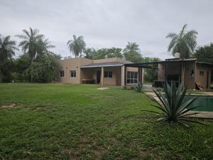 a house with a large yard in front of it at Country house, pool and gazebo 1600 m2, max 7 people in Santa Ana