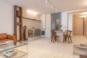 a living room with a couch and a table at Suite d'exception Marais in Paris