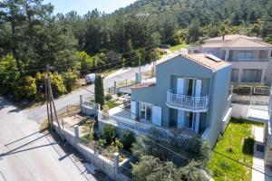 an aerial view of a house with a road at Agapi Deluxe Villa in Skala Rachoniou