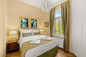 a bedroom with a large bed and a window at Villa Accione Opatija in Opatija +69 photos