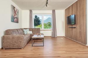 TV a/nebo společenská místnost v ubytování Appartement Haus Drobollach
