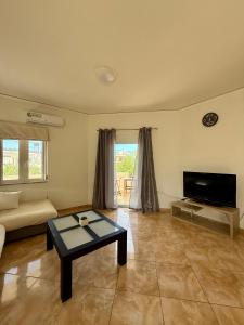TV a/nebo společenská místnost v ubytování Serenity house