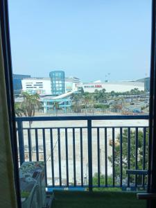 a view of the beach from a hotel room balcony at Sea Residences david in Manila