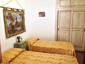 Кровать или кровати в номере Case Vacanza Le Arcate