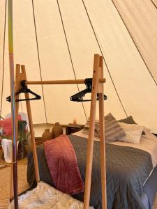 a bedroom with a bed with a tent at Glamping Josephine in Geel
