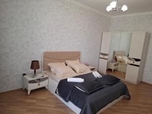 Postel nebo postele na pokoji v ubytování Квартира недалеко от центра на берегу Каспия