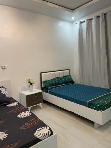 Una cama o camas en una habitación de Jils évasion