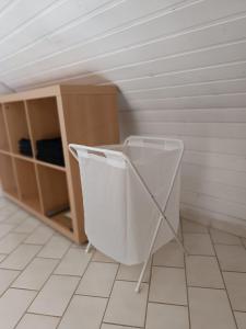 a bathroom with a urinal in a room at 65 qm Ferienwohnung im Grünen in Albbruck +9 photos