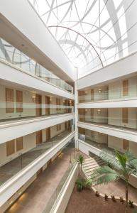 an interior view of a building with a glass ceiling at Boyalik Beach Hotel & Spa Cesme in Çeşme